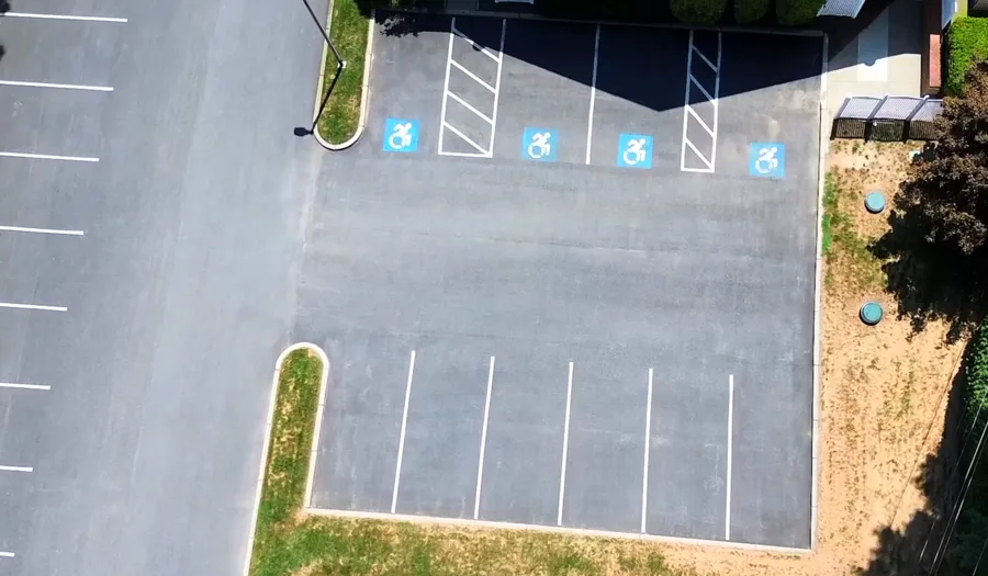 Faded parking lot striping needing re-striping