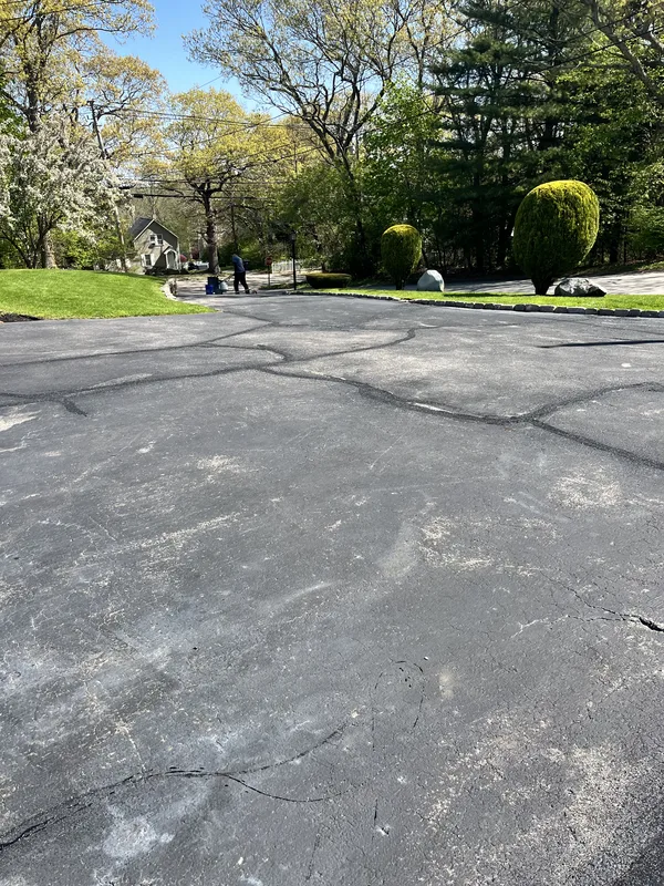 Completed driveway after crack filling and sealcoating