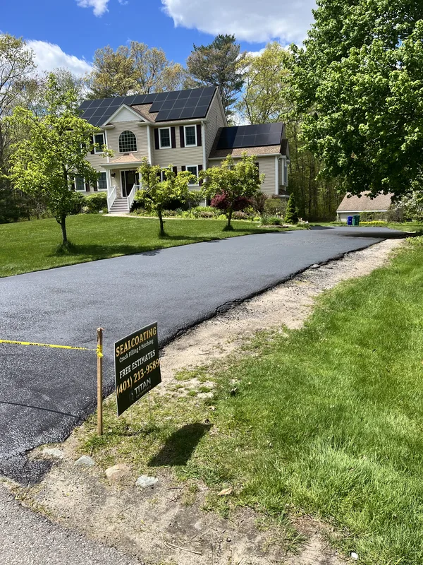 Sealcoating being applied to residential driveway