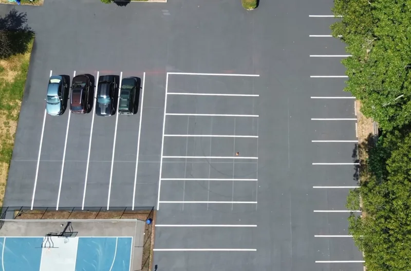 Overhead view of parking lot with freshly painted line striping